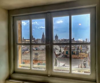 View of cityscape through window