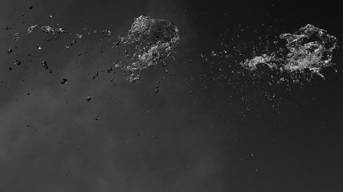 Low angle view of water against sky at night