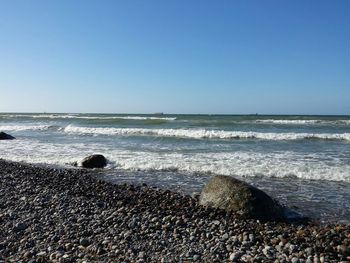 Scenic view of sea against clear sky