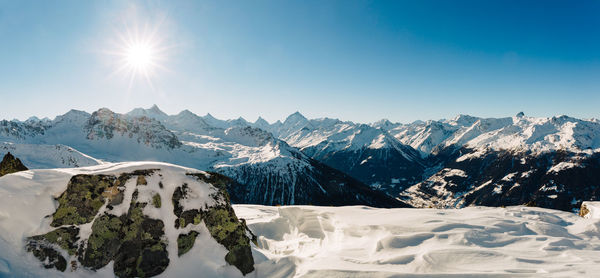 Scenic view of snowcapped mountains against sky