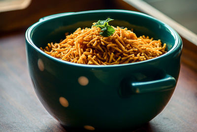 Close-up of noodles in bowl on table