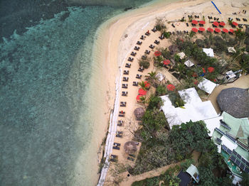 High angle view of beach and sea with tourists