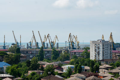 High angle view of buildings and trees against sky