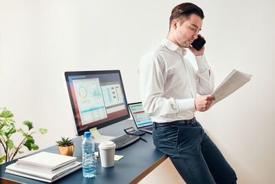 Man entrepreneur having business conversation on mobile phone. businessman manager working in office