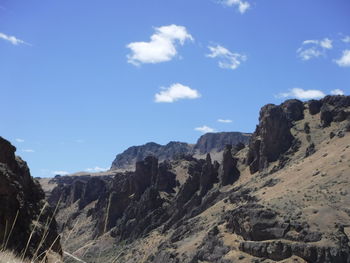 Scenic view of rocky mountains against sky