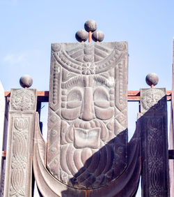 Low angle view of statue against sky