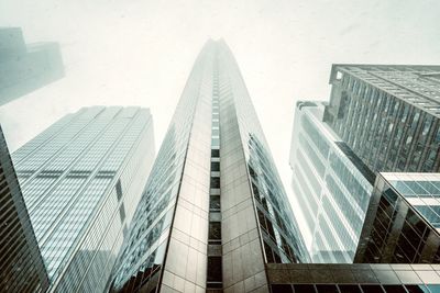 Low angle view of modern buildings against clear sky