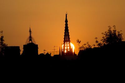 Silhouette of built structure at sunset