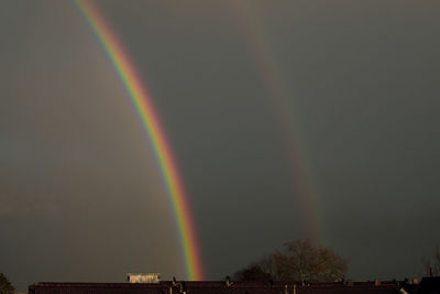Low angle view of rainbow against sky