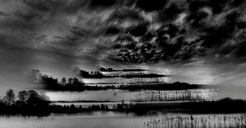 Built structure by trees against sky