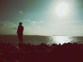 Man looking at sea against sky