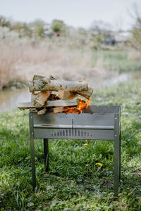 View of burning firewood on grill