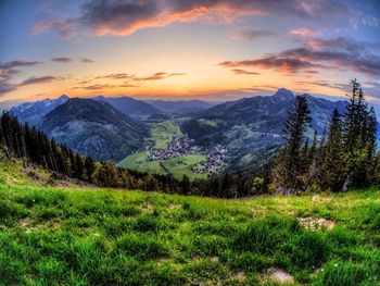 Scenic view of mountains against cloudy sky