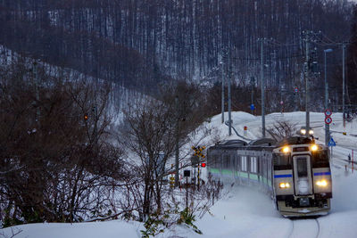 Train on railroad tracks during winter