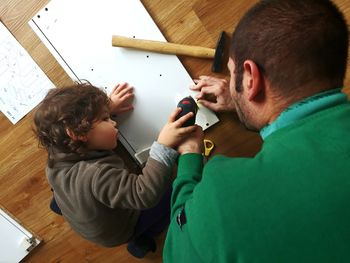 Father and boy working together