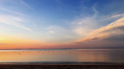 Scenic view of sea against sky at sunset