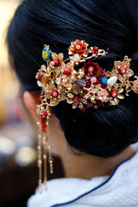 Rear view of bride wearing headdress during wedding ceremony