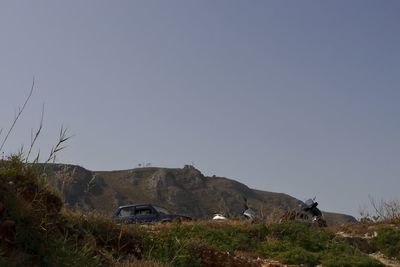 Scenic view of land against clear sky