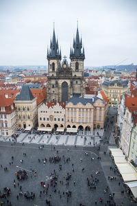 High angle view of crowd in town against sky