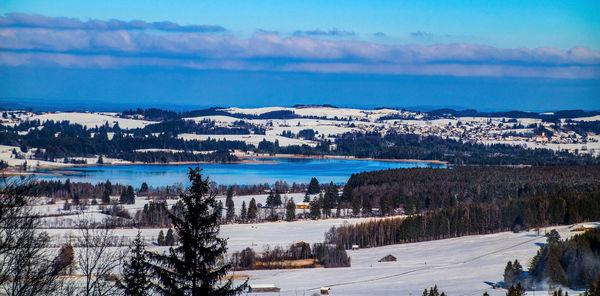 Scenic view of snowcapped landscape against sky during winter