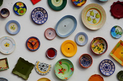 Directly above shot of colorful plates arranged on table