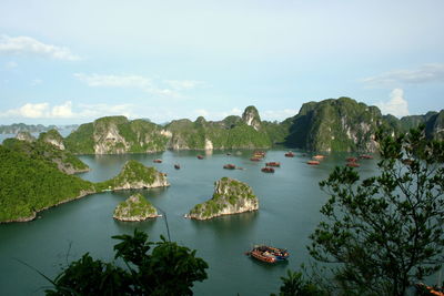 Scenic view of rock formations at halong bay against sky