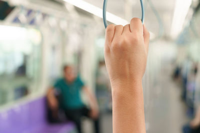 Close-up of hand holding train