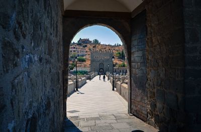 View of historic building seen through arch