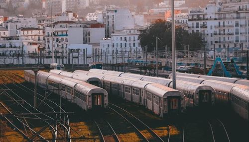 High angle view of train amidst buildings in city