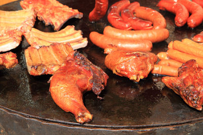 High angle view of meat on barbecue grill