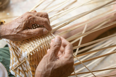 Close-up of woman hand holding basket