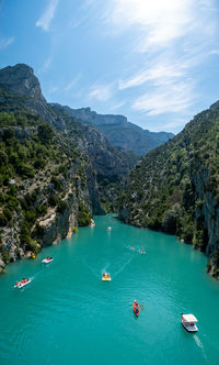 High angle view of boats in sea against sky