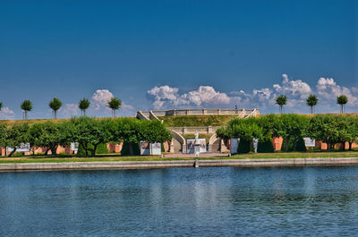 Scenic view of lake against blue sky