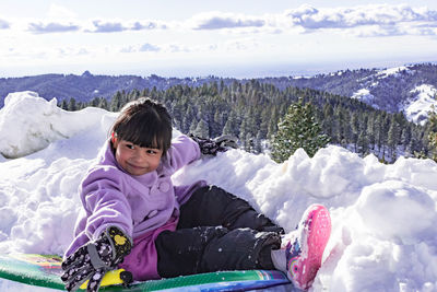 Girl in snow covered mountains during winter