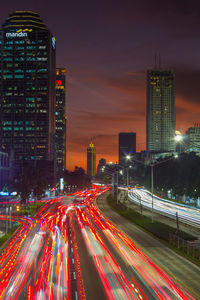 High angle view of light trails on city at night