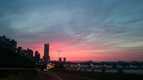 Road in city at sunset