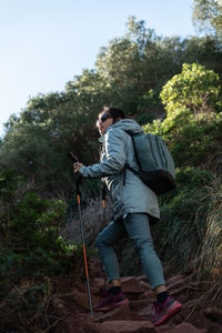 Rear view of man standing on mountain