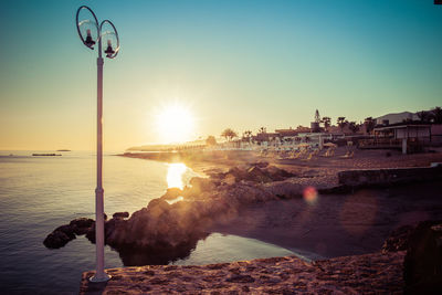 Scenic view of sea against clear sky during sunset