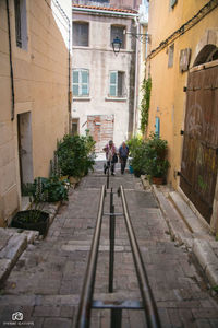 People walking on cobblestone street