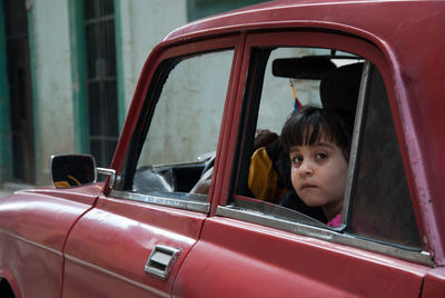 Portrait of woman sitting in car