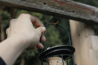 Close-up of hand holding metal