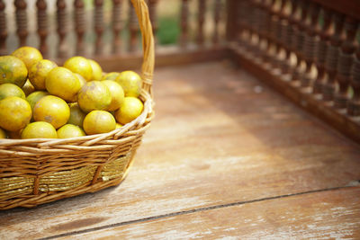 Close-up of fruits in basket on table