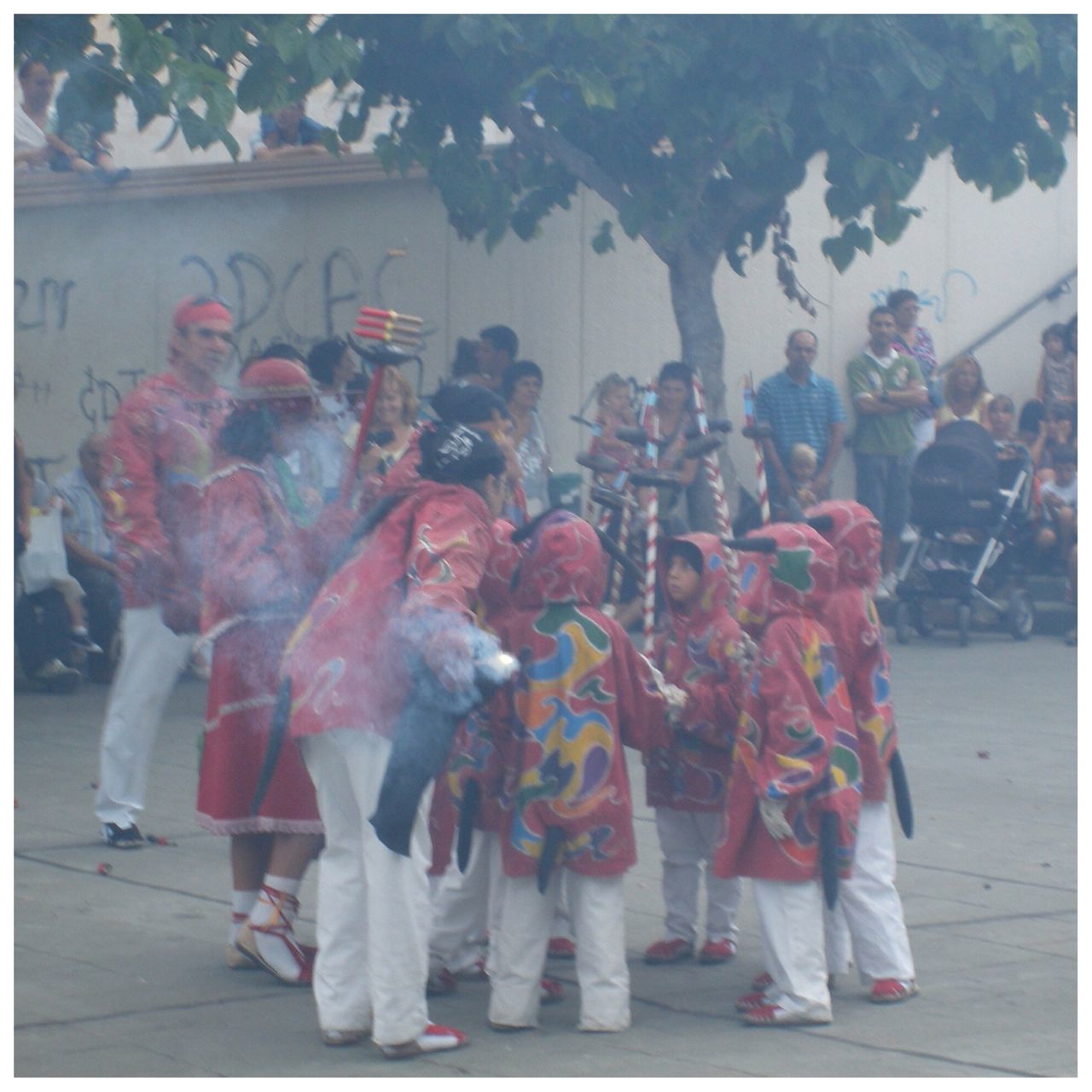 transfer print, lifestyles, auto post production filter, person, men, leisure activity, casual clothing, standing, large group of people, togetherness, full length, rear view, traditional clothing, celebration, street, cultures, walking, crowd