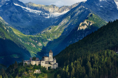 Scenic view of mountains against sky and castle