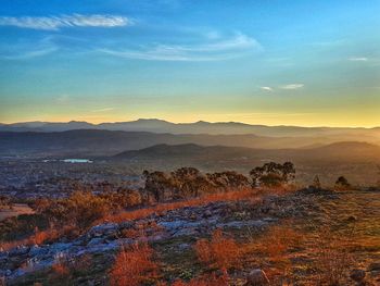 Scenic view of landscape against sky during sunset