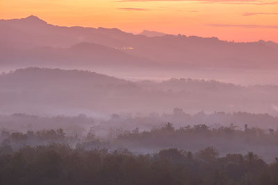 Scenic view of mountains against sky during sunset