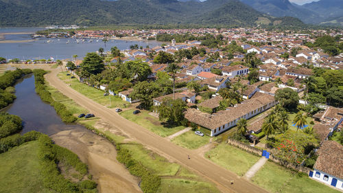 High angle view of townscape by sea