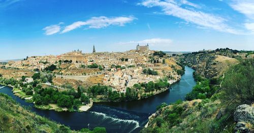 Panoramic view of river and buildings against sky