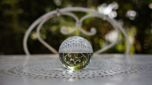 Close-up of crystal ball on table