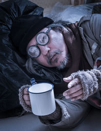 Portrait of man with coffee cup